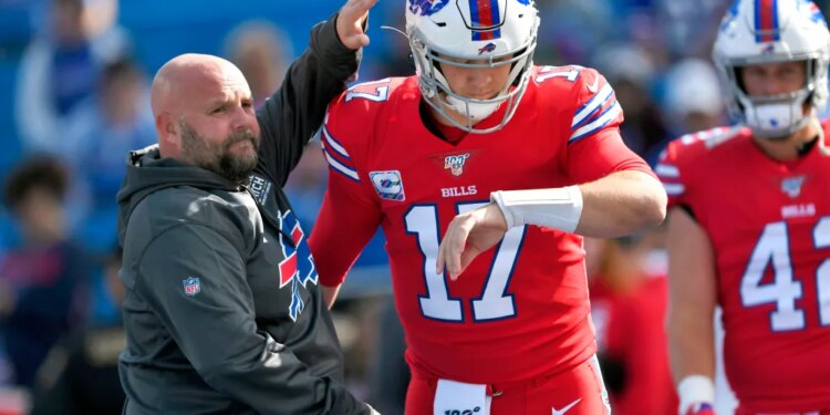 Buffalo Bills offensive coordinator Brian Daboll, left, encourages quarterback Josh Allen as he warms up before an NFL football game Miami Dolphins, Sunday, Oct. 20, 2019, in Orchard Park, N.Y.