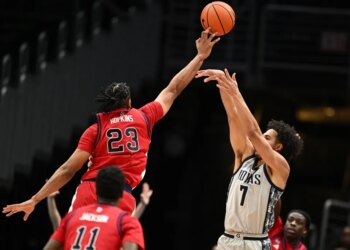 Bryce Hopkins blocks Isaiah Abraham's shot during the first half of St. John's 95-83 win over Georgetown on Dec. 31, 2025 in Washington.