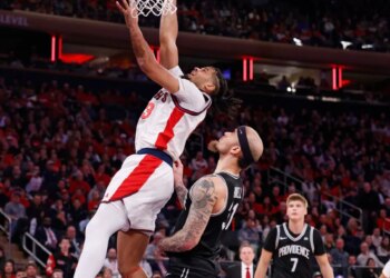 Bryce Hopkins #23 of the St. John's Red Storm goes up for a shot over Duncan Powell #31 of the Providence Friars during the second half when the St. John's Red Storm played the Providence Friars Saturday, January 3, 2026 at Madison Square Garden