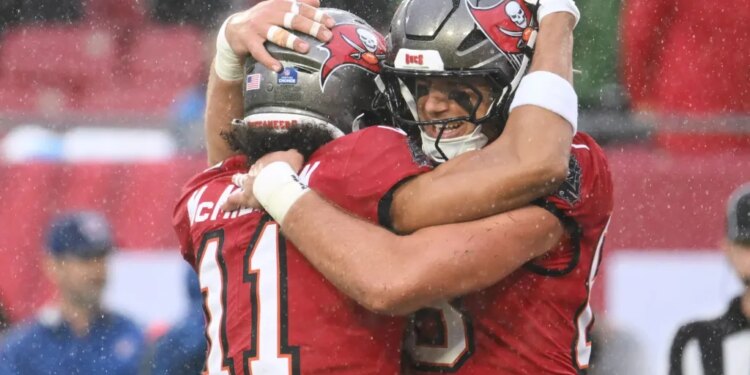 An image collage containing 1 images, Image 1 shows Tampa Bay Buccaneers tight end Cade Otton (88) celebrates his touchdown catch with wide receiver Jalen McMillan (11) during the first half of an NFL football game against the Carolina Panthers Saturday, Jan. 3, 2026, in Tampa, Fla