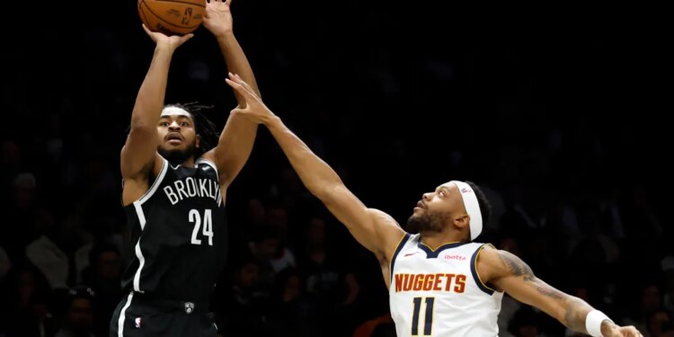 Brooklyn Nets puts up a shot as Bruce Brown #11 of the Denver Nuggets jumps to defend in the second half. The Brooklyn Nets defeat the Denver Nuggets at the Barclays Center in Brooklyn, New York, Sunday, January 04, 2026.
