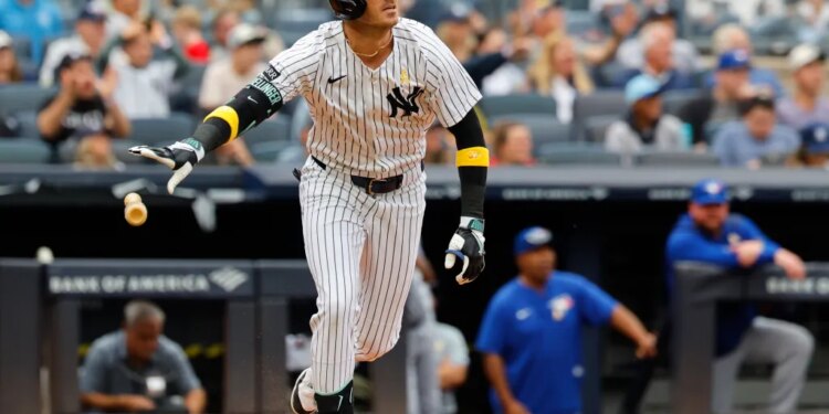 New York Yankees Cody Bellinger tosses his bat after hitting a RBI double during the third inning of a MLB baseball game against the Toronto Blue Jays at Yankee Stadium. Sunday, Sept. 7, 2025 in New York.