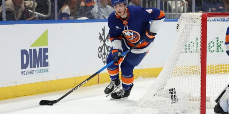 Islanders defenseman Cole McWard (4) skates with the puck against the Toronto Maple Leafs during the third period at UBS Arena.