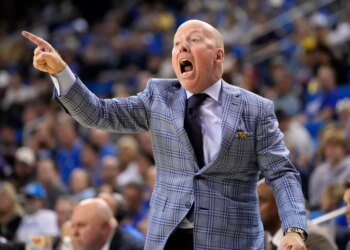 Northwestern basketball coach Chris Collins shouting and pointing during a game against UCLA.