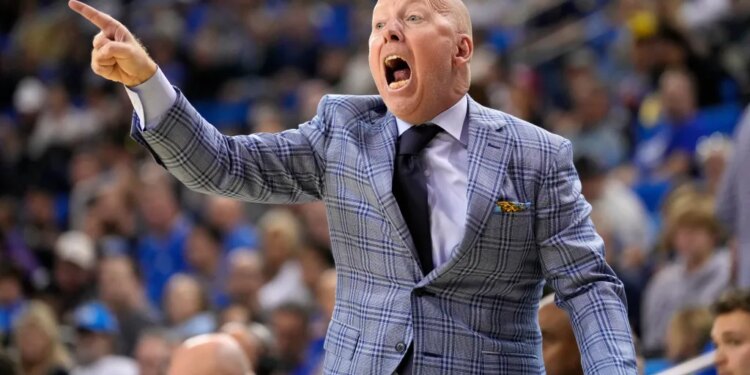 Northwestern basketball coach Chris Collins shouting and pointing during a game against UCLA.