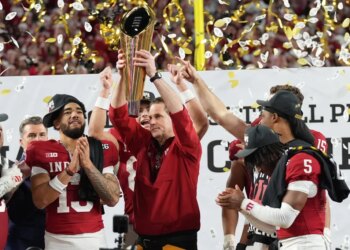 Indiana head coach Curt Cignetti holds the trophy after their win against Miami in the College Football Playoff national championship game, Monday, Jan. 19, 2026, in Miami Gardens, Fla.