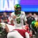 Oregon Ducks quarterback Dante Moore (5) calls a play on the line of scrimmage against the Indiana Hoosiers during the first quarter of the 2025 Peach Bowl and semifinal game of the College Football Playoff at Mercedes-Benz Stadium.