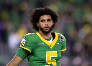 Oregon quarterback Dante Moore (5) looks on during the first half of the first round of the NCAA College Football Playoff against James Madison, Saturday, Dec. 20, 2025, in Eugene, Ore.