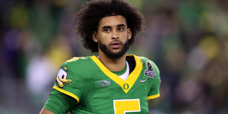 Oregon quarterback Dante Moore (5) looks on during the first half of the first round of the NCAA College Football Playoff against James Madison, Saturday, Dec. 20, 2025, in Eugene, Ore.