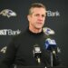 Baltimore Ravens head coach John Harbaugh speaking at a news conference.