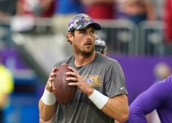 Minnesota Vikings quarterback Sean Mannion warms up before a preseason NFL football game against the San Francisco 49ers, Aug. 20, 2022, in Minneapolis. (