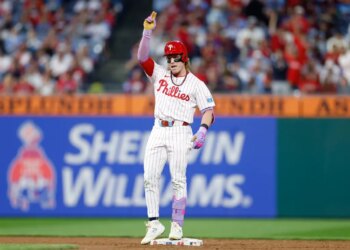 Philadelphia Phillies player Harrison Bader celebrates hitting a double.