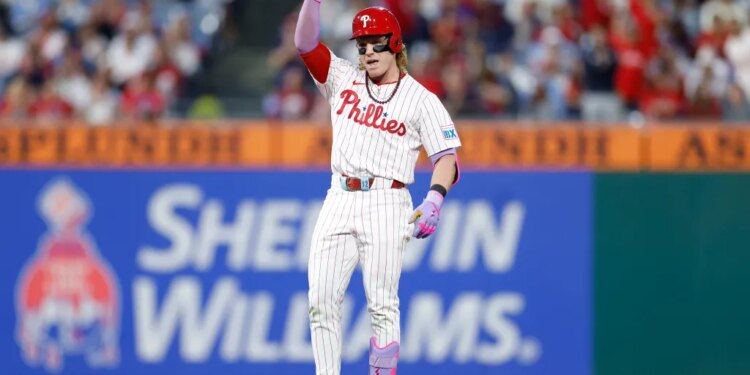 Philadelphia Phillies player Harrison Bader celebrates hitting a double.