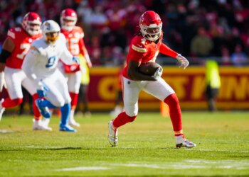 Kansas City Chiefs wide receiver Rashee Rice (4) runs for yards after the catch against the Los Angeles Chargers during the first quarter at GEHA Field at Arrowhead Stadium.