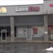 The exterior of a GameStop store with a "This Store is Closing" sign in the window, next to Moon's Thai & Myanmar Cuisine.