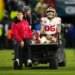 San Francisco 49ers tight end George Kittle (85) is carted off the field after an injury during an NFL playoff game.