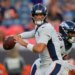 Denver Broncos quarterback Jarrett Stidham looks to pass.