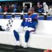 Giants guard Jermaine Eluemunor (72) sits on the bench after the Commanders beat the Giants.