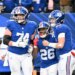 New York Giants running back Devin Singletary (26) celebrates with New York Giants guard Greg van Roten (74) and New York Giants quarterback Jaxson Dart (6) after he runs the ball in for a touchdown during the fourth quarter of the Giants and Dallas Cowboys game in East Rutherford, NJ.