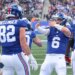 Giants tight end Daniel Bellinger (l.) celebrates his touchdown with QB Jaxson Dart (r.) on Jan. 4, 2026.