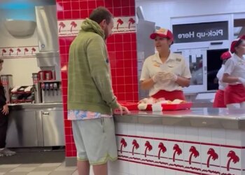 Adam Sandler ordering food at an In-N-Out fast food chain.
