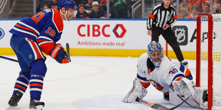 New York Islanders goaltender Ilya Sorokin (30) makes a save against a shot by Edmonton Oilers forward Zach Hyman (18) during the first period at Rogers Place.