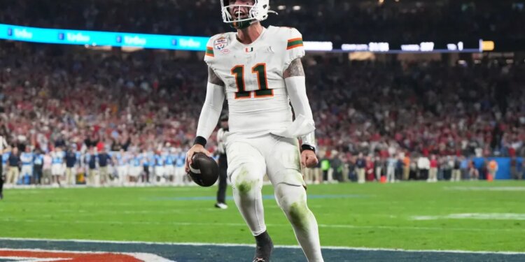 Miami quarterback Carson Beck scores a touchdown during the Fiesta Bowl.