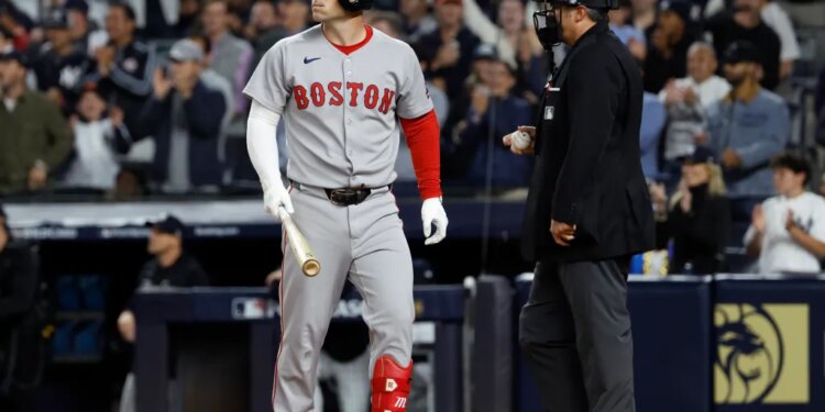 Boston Red Sox player Alex Bregman reacts after striking out in a game against the New York Yankees.