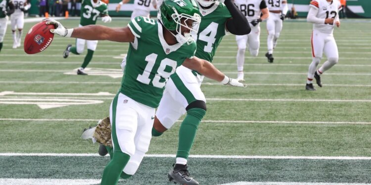 New York Jets player Isaiah Williams #18 scores a touchdown against the Cleveland Browns.