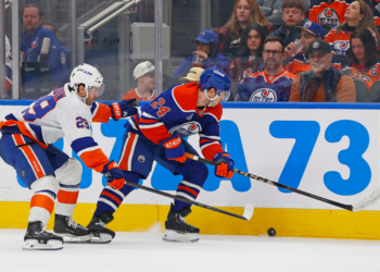 Jonathan Drouin (left) looks to take the puck away from Spencer Stastney during the second period of the Islanders' 1-0 road win over the Oilers on Jan. 15, 2026.