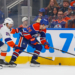 Jonathan Drouin (left) looks to take the puck away from Spencer Stastney during the second period of the Islanders' 1-0 road win over the Oilers on Jan. 15, 2026.