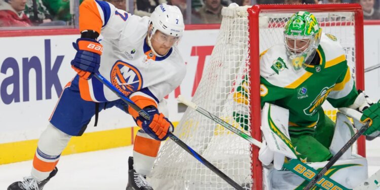 Maxim Tsyplakov (7) attempts a wraparound shot on Filip Gustavsson (32) during a hockey game.
