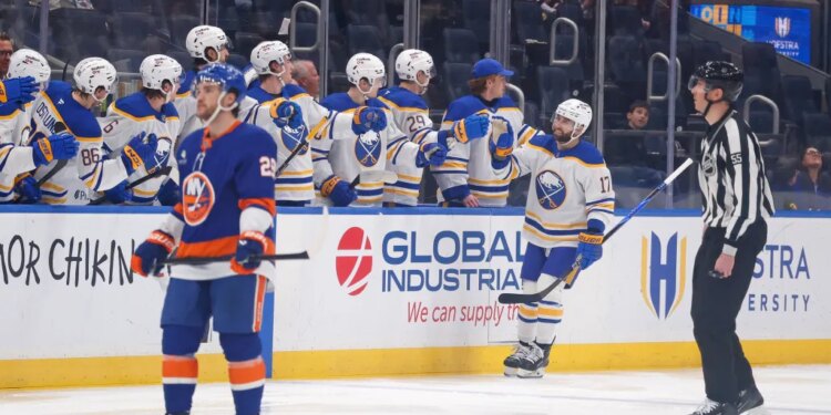 Jason Zucker #17 of the Buffalo Sabres is greeted by his teammates on the bench after scoring a goal during the second period when the New York Islanders played the Buffalo Sabres Saturday, January 24, 2026 at UBS Arena in Elmont, NY.