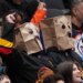 Vancouver Canucks fans wear paper bags on their heads during a 6-0 loss to the Edmonton Oilers.