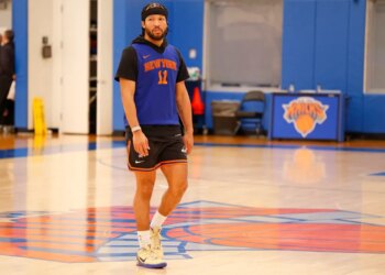 Jalen Brunson in practice gear on a basketball court.