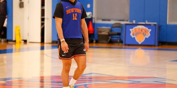 Jalen Brunson in practice gear on a basketball court.