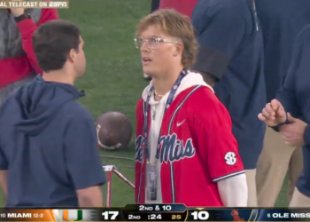 Jaxson Dart on the sidelines with John Harbaugh.