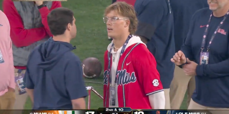 Jaxson Dart on the sidelines with John Harbaugh.