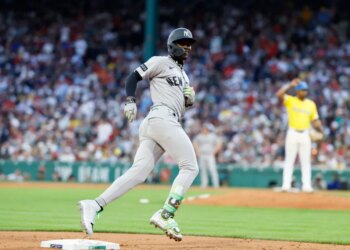 Jazz Chisholm Jr. #13 of the New York Yankees reacts as he rounds the bases on his solo homer during the fifth inning.