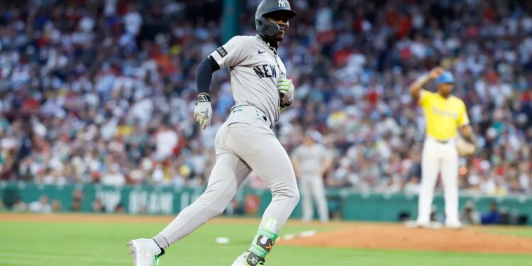 Jazz Chisholm Jr. #13 of the New York Yankees reacts as he rounds the bases on his solo homer during the fifth inning.