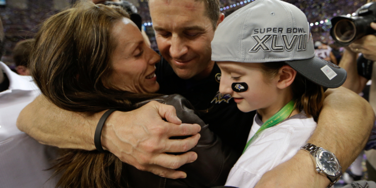John Harbaugh embraces his wife Ingrid and daughter Alison after the Super Bowl XLVII victory.