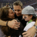 John Harbaugh embraces his wife Ingrid and daughter Alison after the Super Bowl XLVII victory.