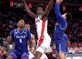 Joson Sanon #3 jumps to defend against Seton Hall Pirates guard Adam Clark #0 during the first half as St. John's Red Storm plays against Seton Hall Pirates at Madison Square Garden in Manhattan, New York.