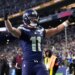 Seattle Seahawks wide receiver Jaxon Smith-Njigba (11) celebrates his touchdown catch during the first half of the NFC Championship NFL football game against the Los Angeles Rams, Sunday, Jan. 25, 2026, in Seattle.