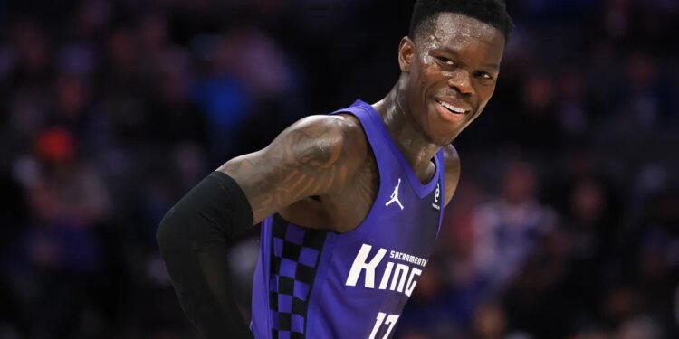 Sacramento Kings guard Dennis Schroder smiles between plays.