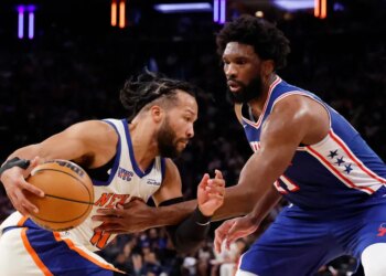 Jalen Brunson drives to the basket as Philadelphia 76ers center Joel Embiid defends in the second half at Madison Square Garden in Manhattan, New York, Saturday, January 03, 2026.