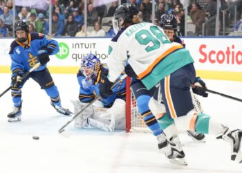 Kristyna Kaltounkova (98), who scored two goals, brings the puck around the net to shoot at goaltender Elaine Chuli, second left, during the first period of the Sirens' 2-0 win over the Sceptres on Jan. 6, 2025 in Toronto.