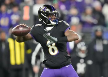 Baltimore Ravens quarterback Lamar Jackson (8) passes against the New England Patriots during the first half of an NFL football game, Sunday, Dec. 21, 2025, in Baltimore.