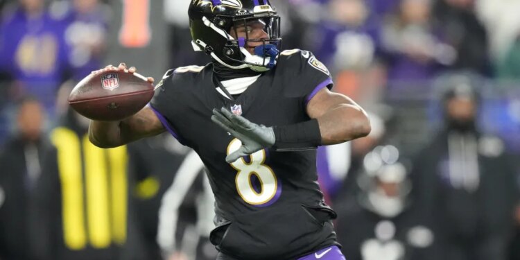 Baltimore Ravens quarterback Lamar Jackson (8) passes against the New England Patriots during the first half of an NFL football game, Sunday, Dec. 21, 2025, in Baltimore.