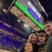 A family of four, including Bubba Watson, taking a selfie at a Lakers game in the Smoothie King Center.